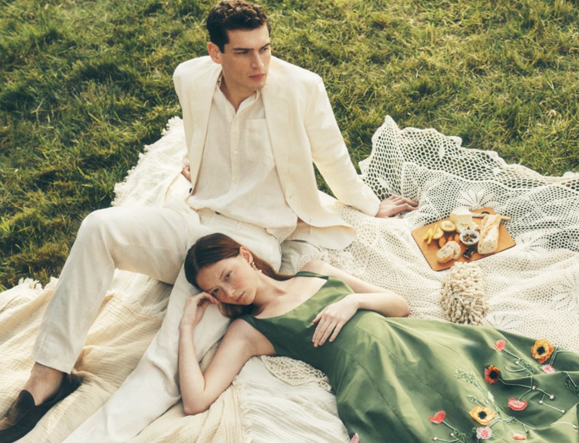 Woman and Man eating snacks in a field