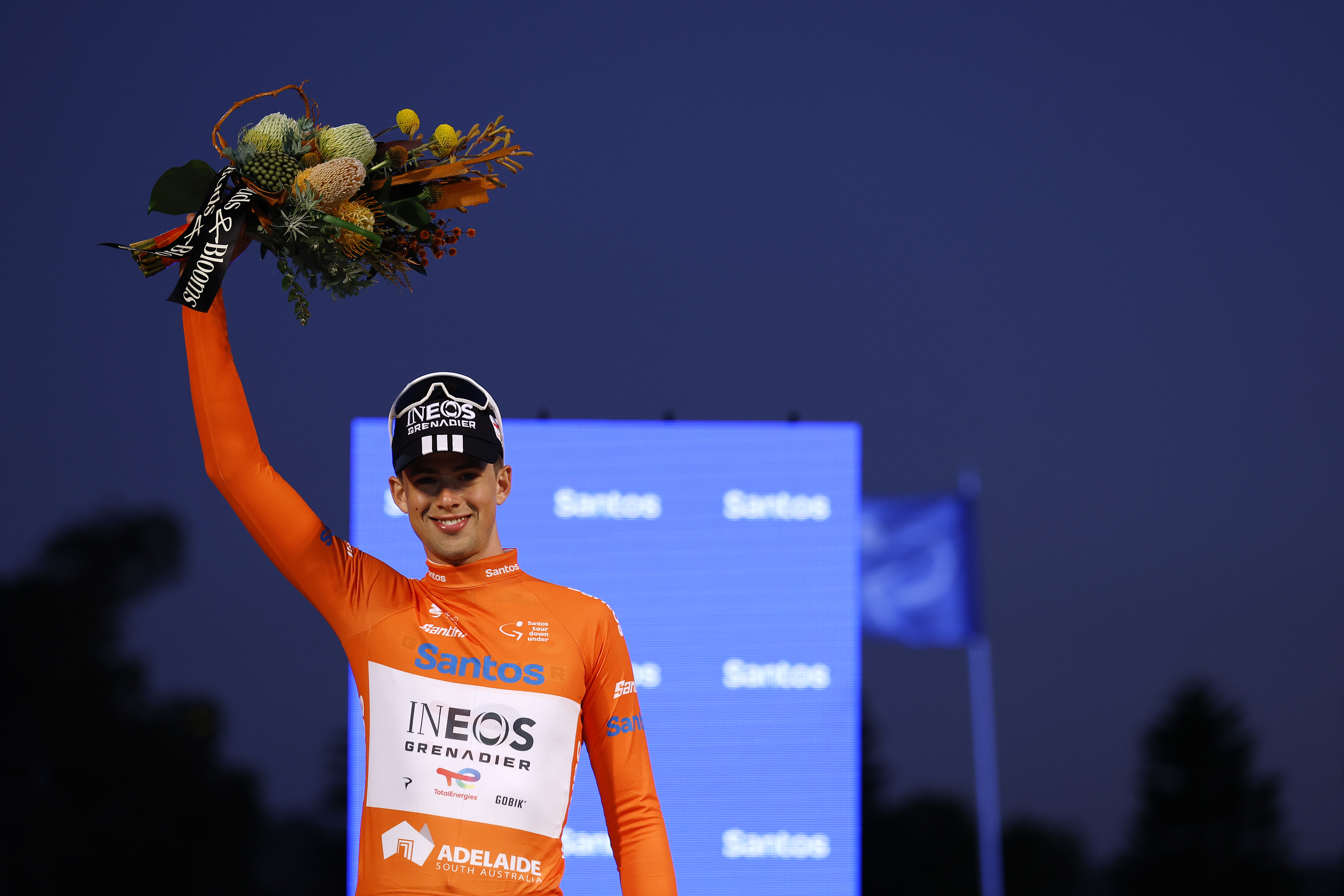 ADELAIDE, AUSTRALIA - JANUARY 20: Samuel Watson of Great Britain and Team INEOS Grenadiers celebrates at podium as the Orange Leader Jersey winner during the 26th Santos Tour Down Under 2026 - Prologue a 3.6km individual time trial stage from Adelaide to Adelaide / #UCIWT / on January 20, 2026 in Adelaide, Australia. (Photo by Con Chronis/Getty Images)