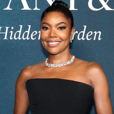 Gabrielle Union attended the Tiffany & Co. Blue Book event in a black-and-brown color combination gown