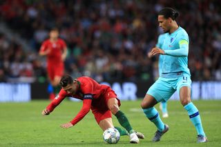 Portugal captain Cristiano Ronaldo battles with Holland counterpart Virgil Van Dijk in the Nations League final