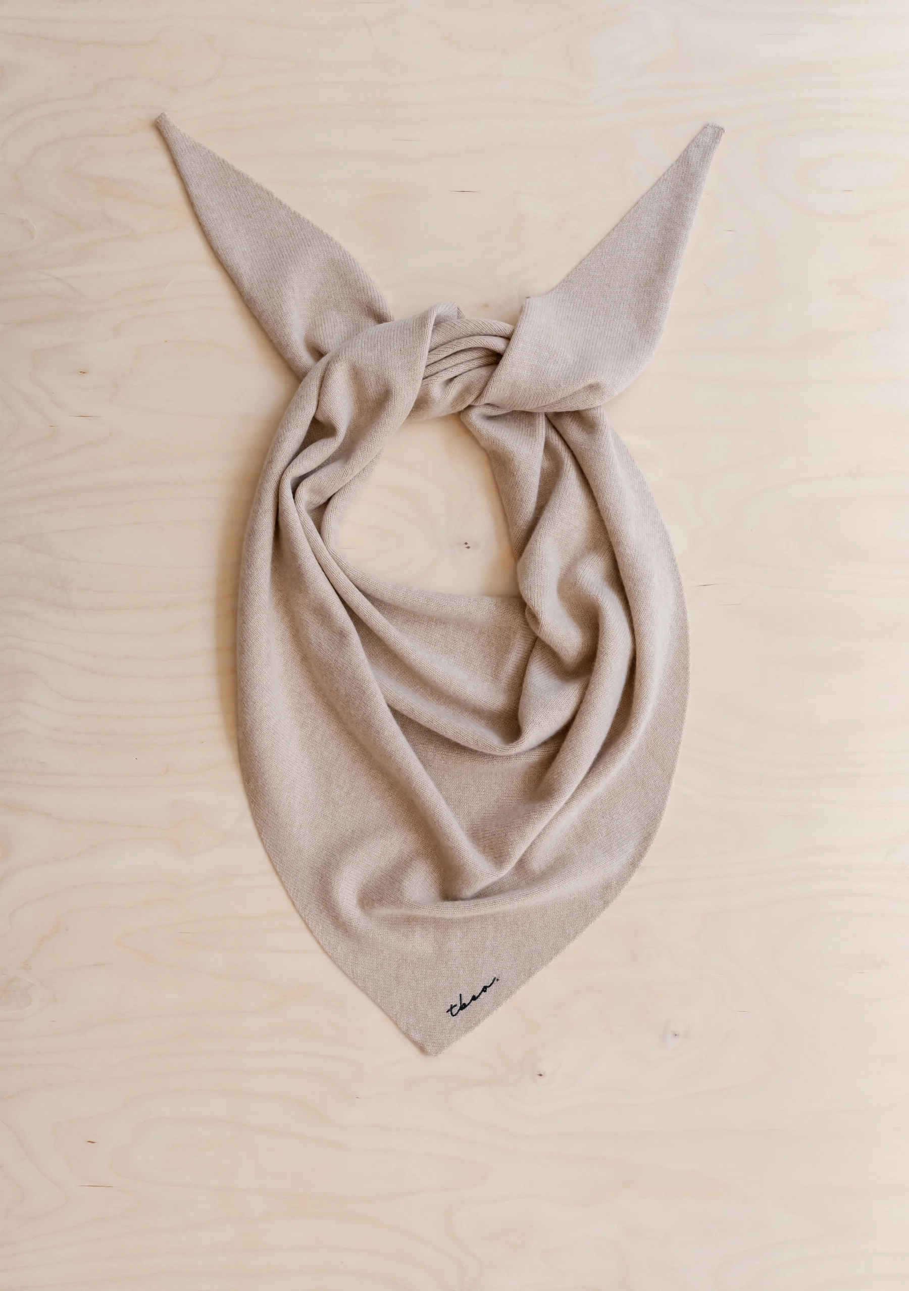 An image of a triangle scarf from TBCco