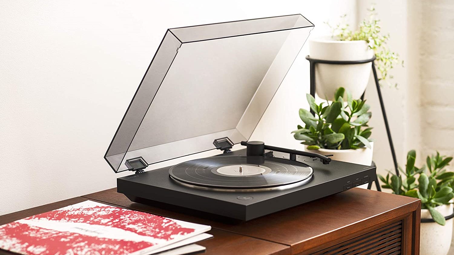 Sony turntable in lifestyle setting with records