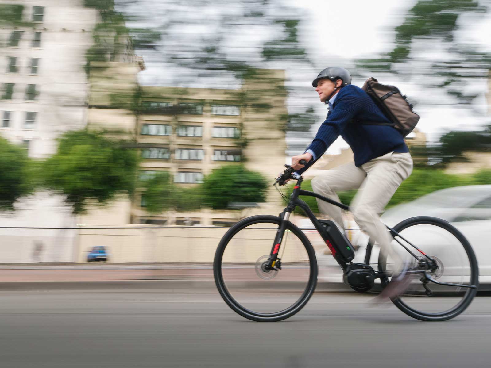 Commuter e-bike side on, moving at speed