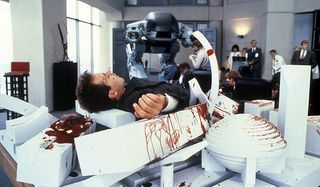 Robocop ED-209's bloody victim collapsed on a model