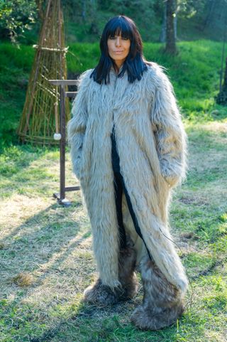 Claudia Winkleman The Traitors fur coat and boots