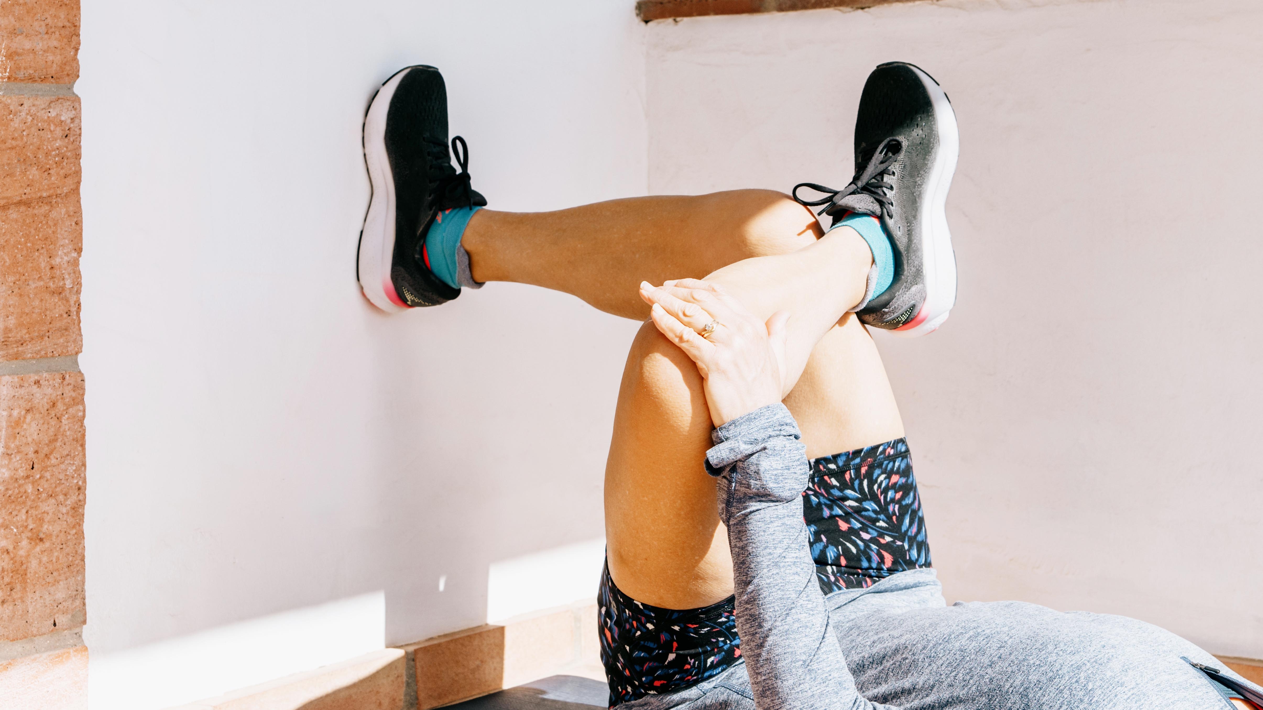 a woman doing the figure four stretch