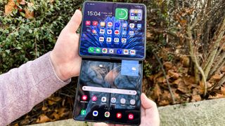 The Oppo Find N2 and Samsung Galaxy Z Fold 4 held together to compare their inner display creases