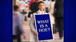 A clue on the November 11, 2024, episode of Jeopardy! shows a photoshopped image of a man wearing a sandwich board that reads, "What is a hoe?"