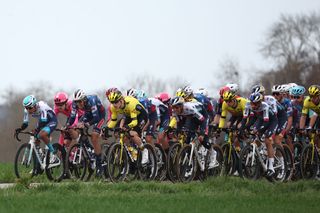 The pack of riders cycles during the 1st stage of the Paris-Nice cycling race, 156,1 km between Le Perray-en-Yvelines and Le Perray-en-Yvelines, on March 9, 2025. (Photo by Anne-Christine POUJOULAT / AFP)