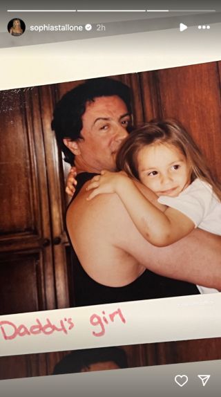 Sylvester Stallone holds one of his kids in photo