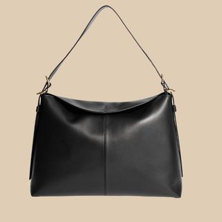 Flat lay image of black leather handbag