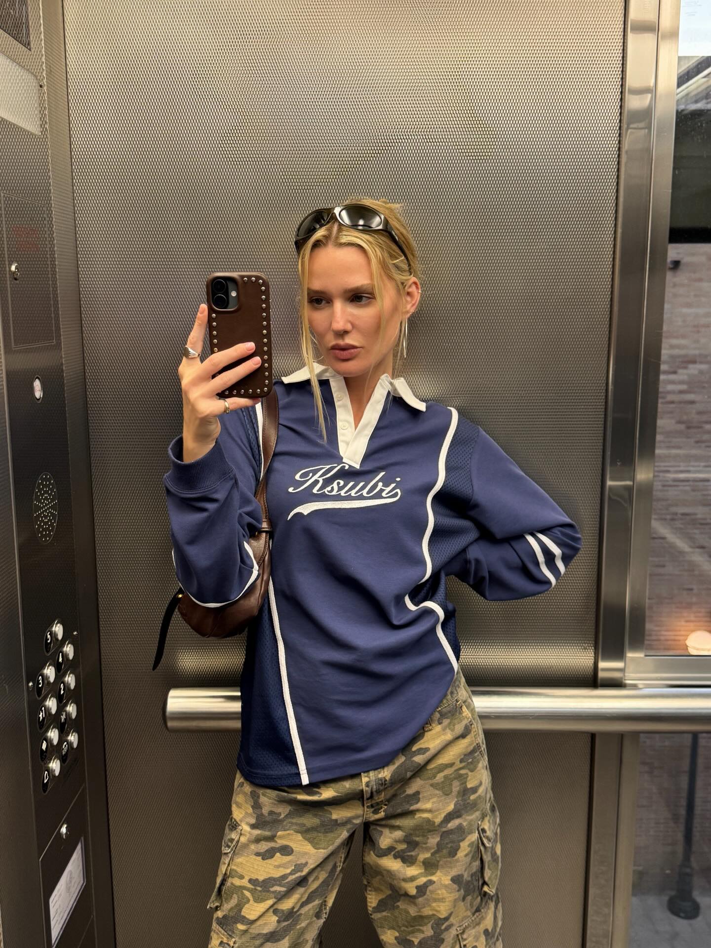 A woman with her hair tied up in a loose updo.