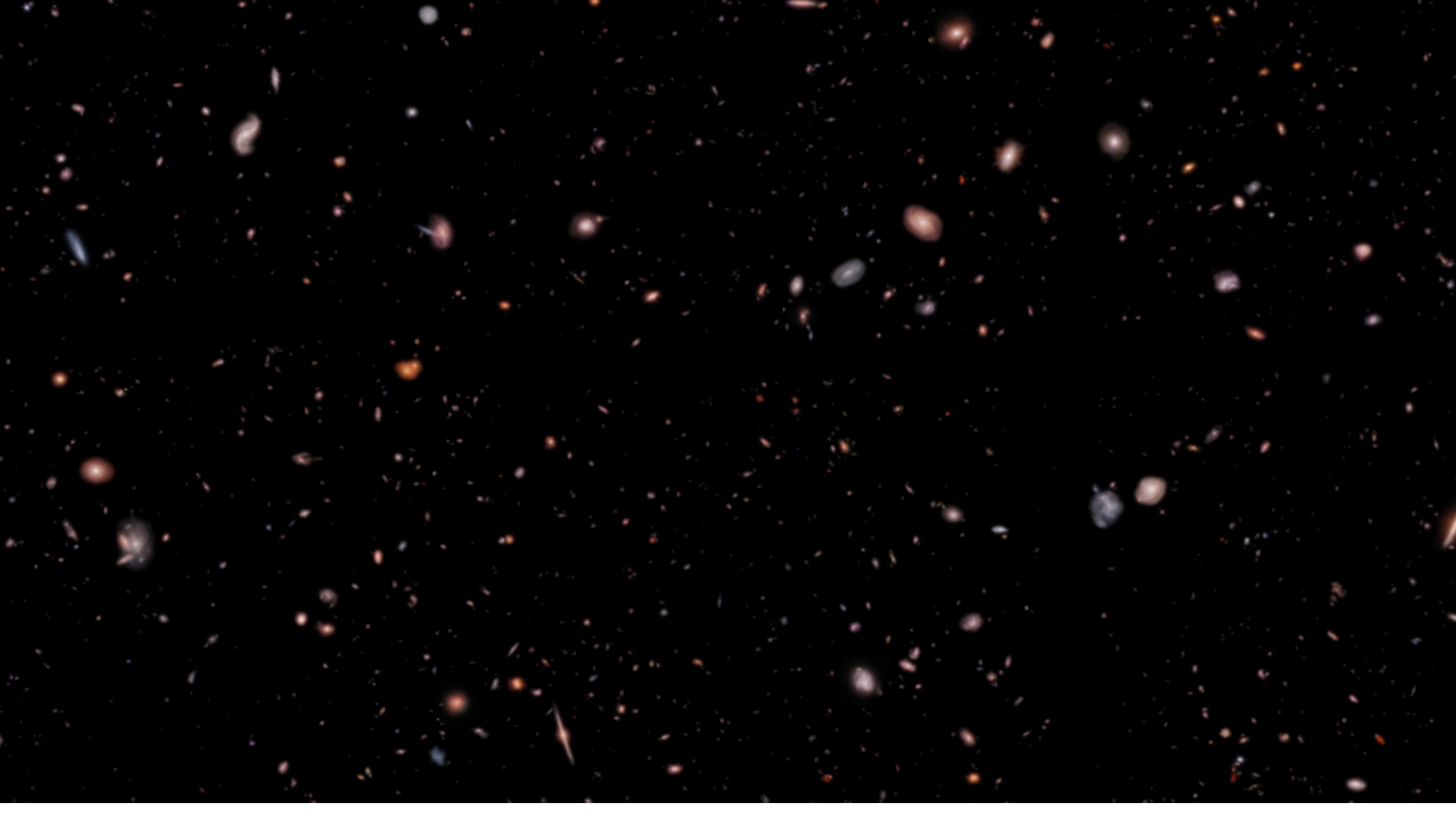 Black background filled with colorful galaxies of different shapes and sizes.