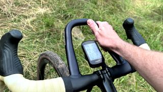 FSA Pro Wing AGX loop gravel handlebar fitted to a bike and being held by one hand