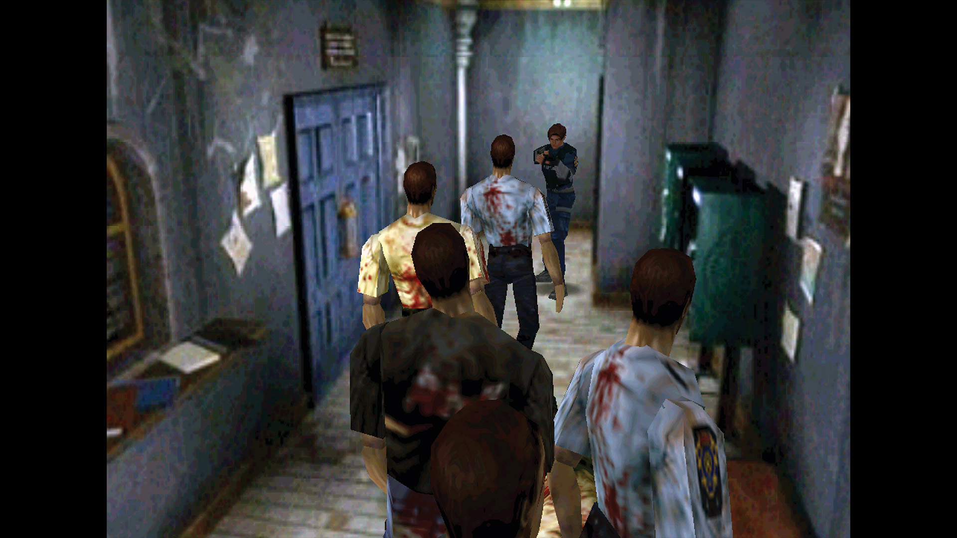 Leon Kennedy keeps a group of zombies at bay with a pistol in Resident Evil 2 for the Nintendo 64 within the police station, from a Retro Gamer article