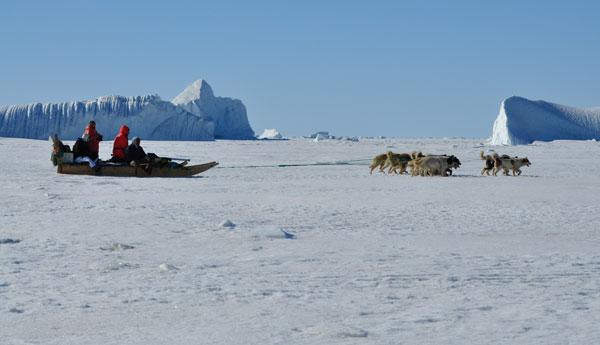 Scientists testing ice thickness measuring equipment before it being permanently mounted on sled.