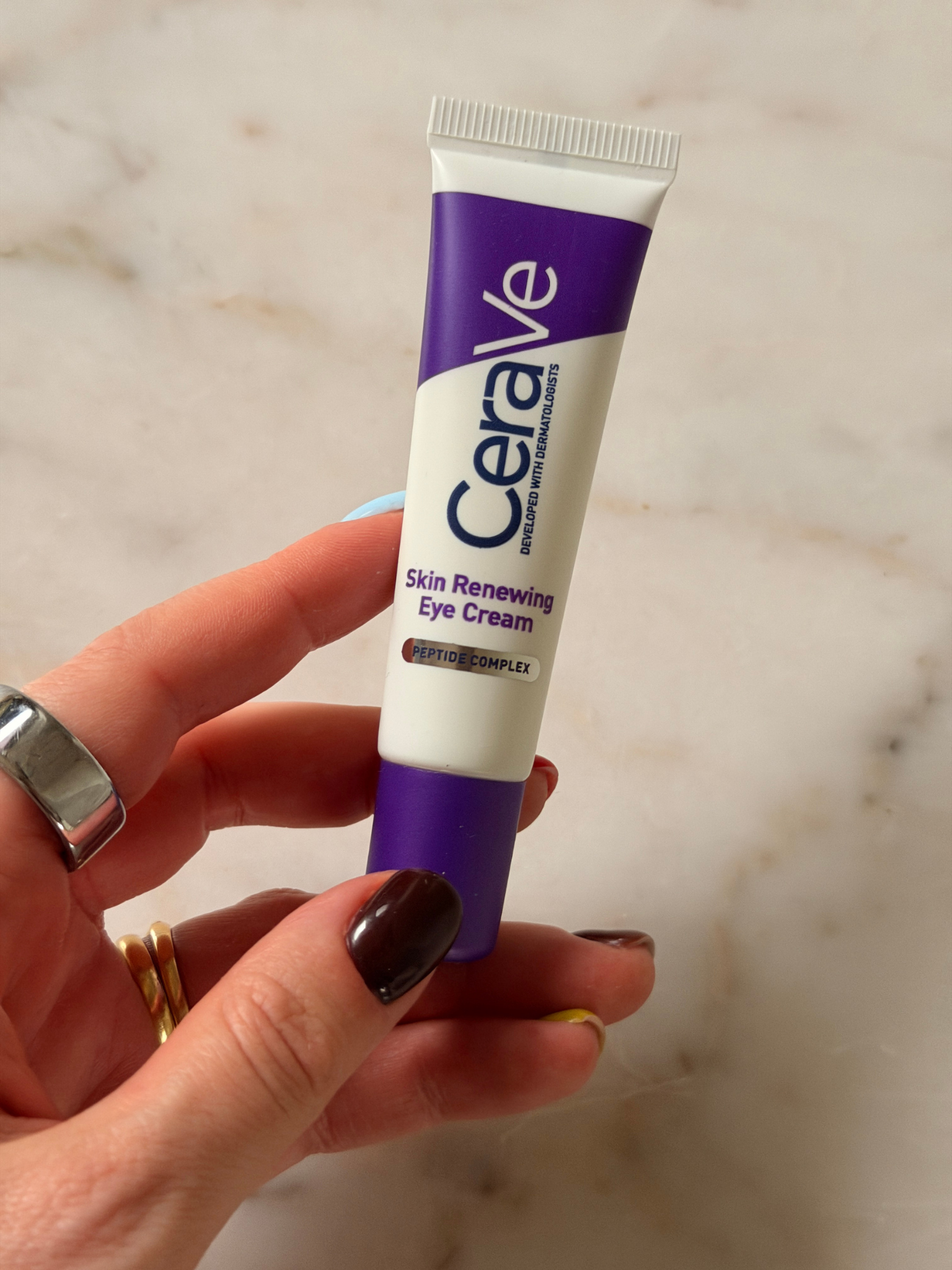Freelance beauty editor Grace Day holding the CeraVe eye cream