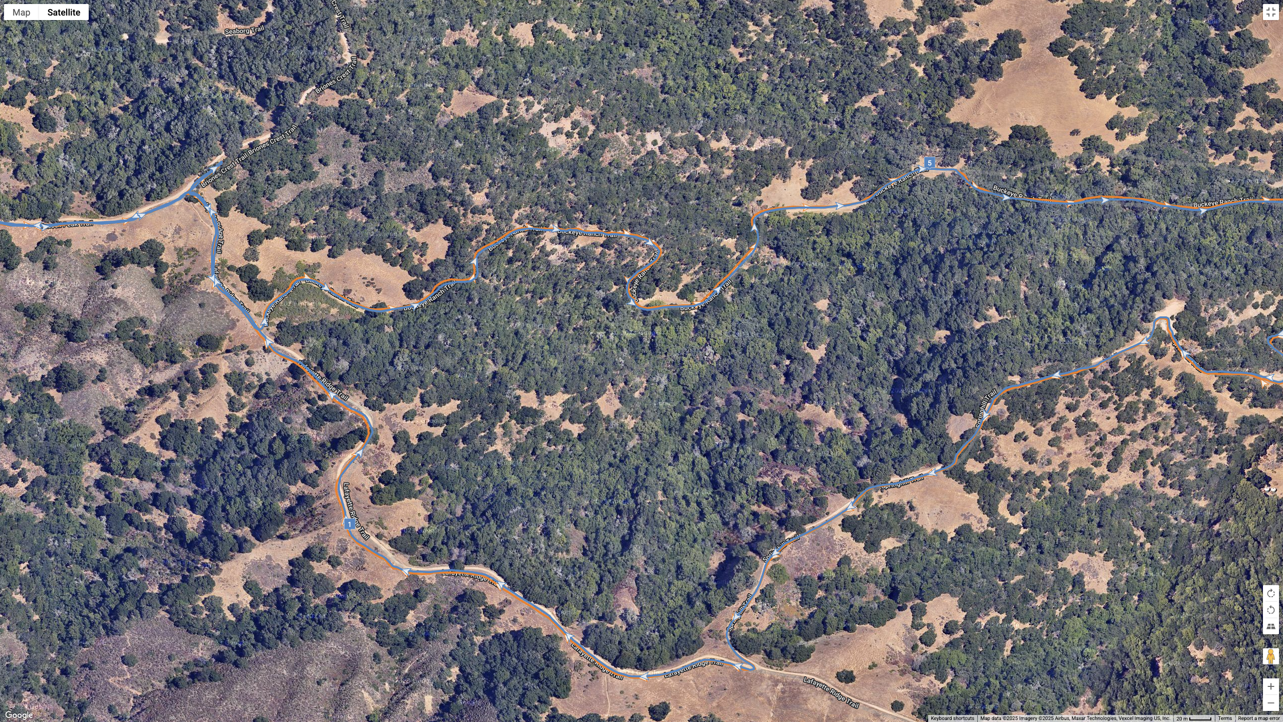 A Google Maps satellite view showing how the COROS APEX 4 (blue) and Garmin Forerunner 970 (orange) compare for GPS-tracked accuracy on a hilly, windy hike.