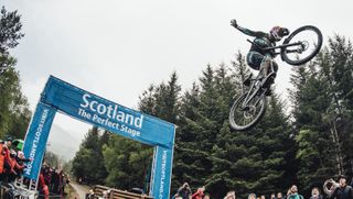 Kade Edwards does a no hander on a jump at Fort William