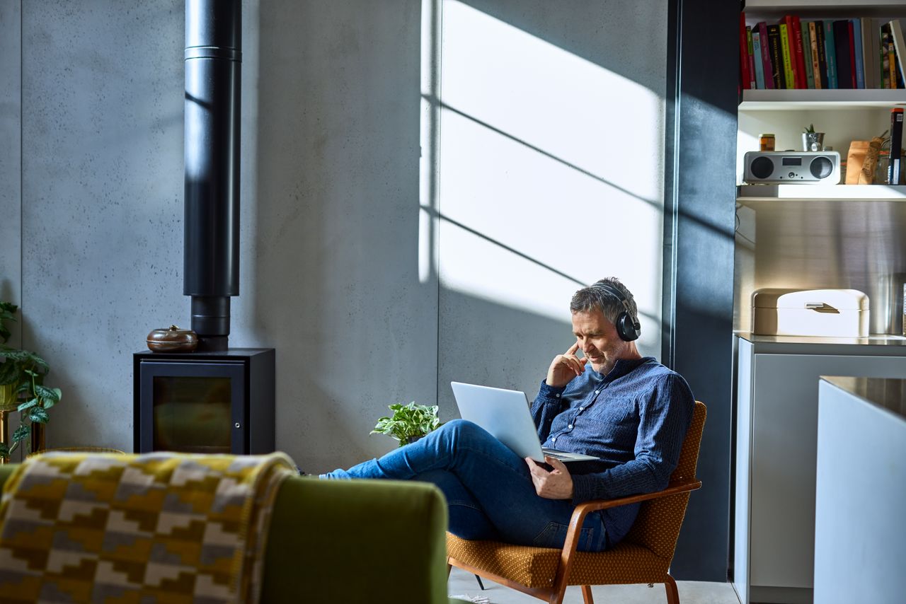 man sitting with laptop 