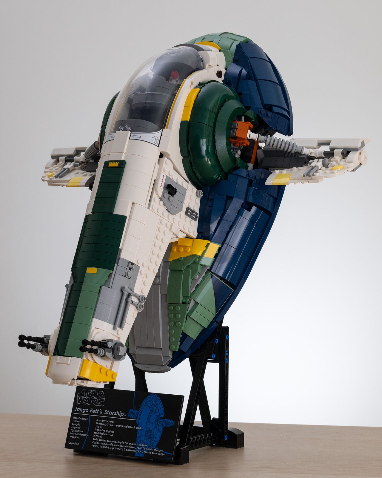 Lego Star Wars UCS Jango Fett&rsquo;s Firespray-Class Starship (75409) on a table with a white background 3/4 image
