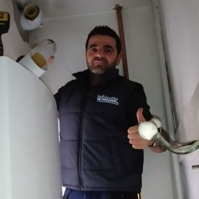 picture of plumbing expert Zhelyazko Yanchev fixing a boiler