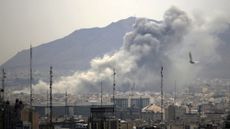 Smoke rises after airstrikes in Tehran