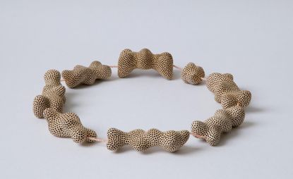 Necklace of brass, bone and balsawood