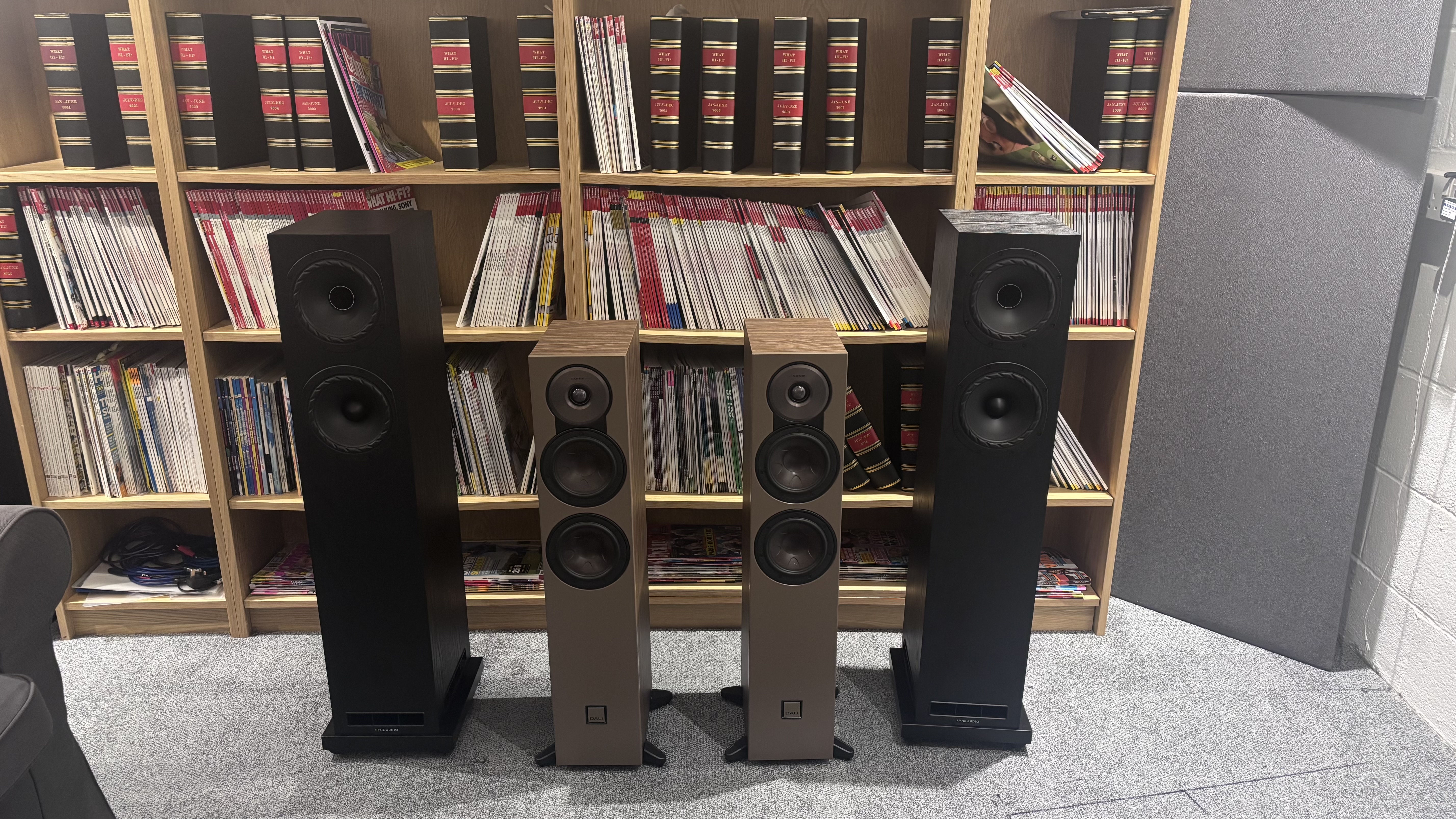 Fyne F501E standing in the test room beside Dali Sonik 5