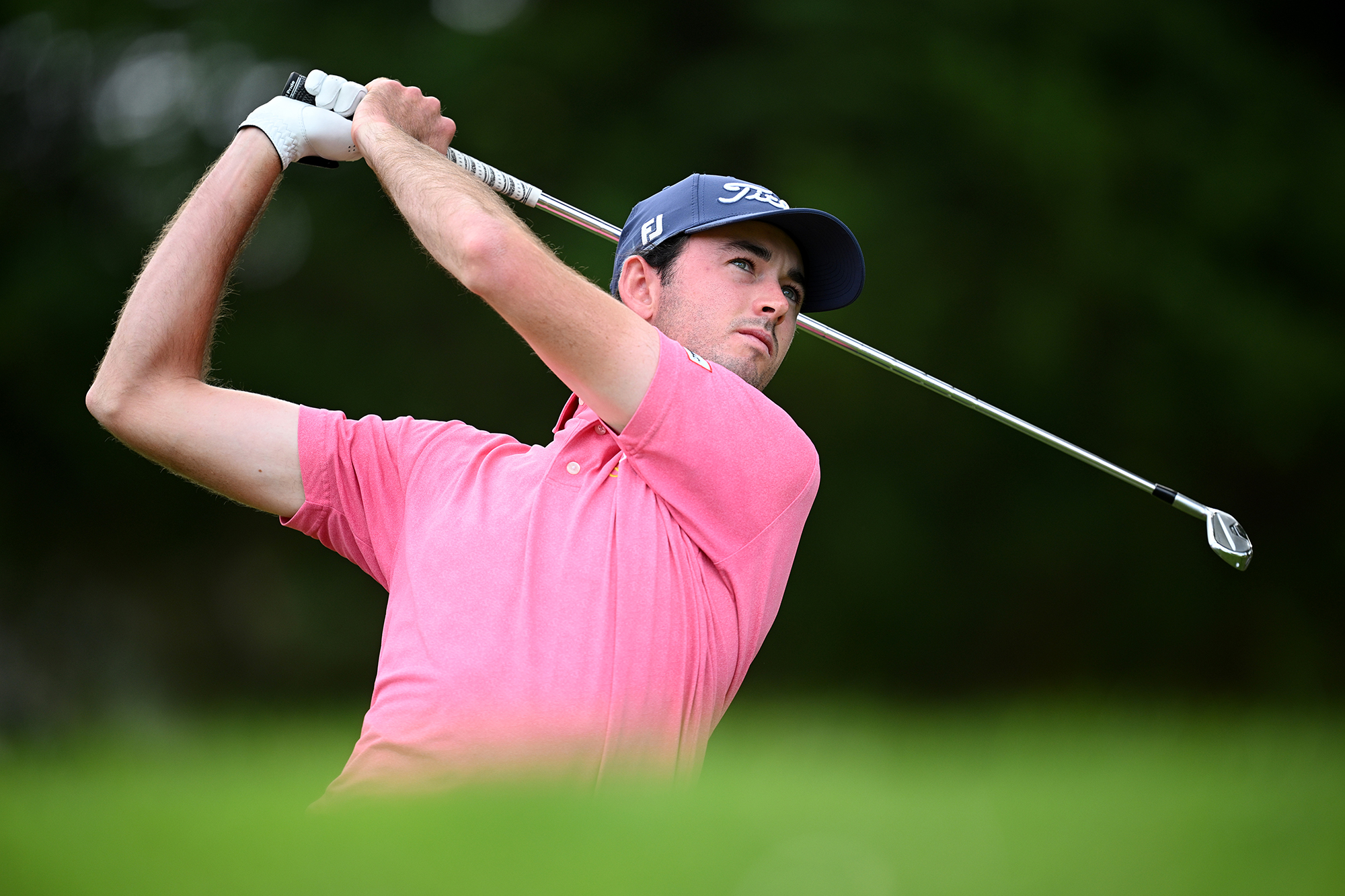 Elvis Smylie in the finish position with an iron, watching his ball flight after hitting a shot