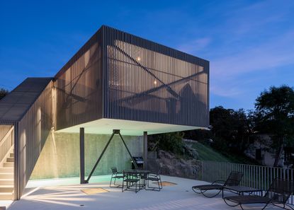 Mount Washington house by Anonymous nestled in the hill, seen from a distance