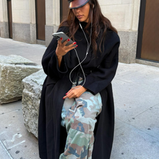 Fashion person Sandra Shehab wears the camo print trouser trend. 