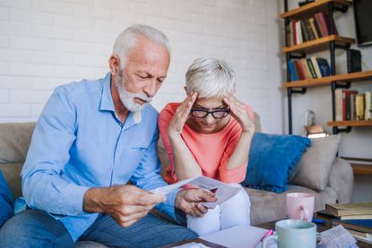 Senior couple looking at financial documents