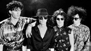 The Sisters Of Mercy posing for a photograph in 1984