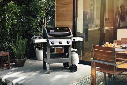 A Weber Spirit II E-310 gas grill on a patio