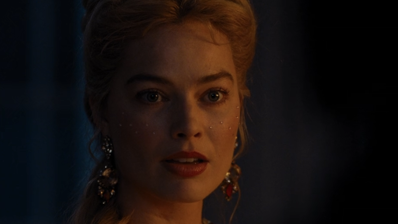 Margot Robbie looking over while at dinner in Wuthering Heights