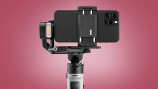 The Zhiyun Crane M2S gimbal on a red background