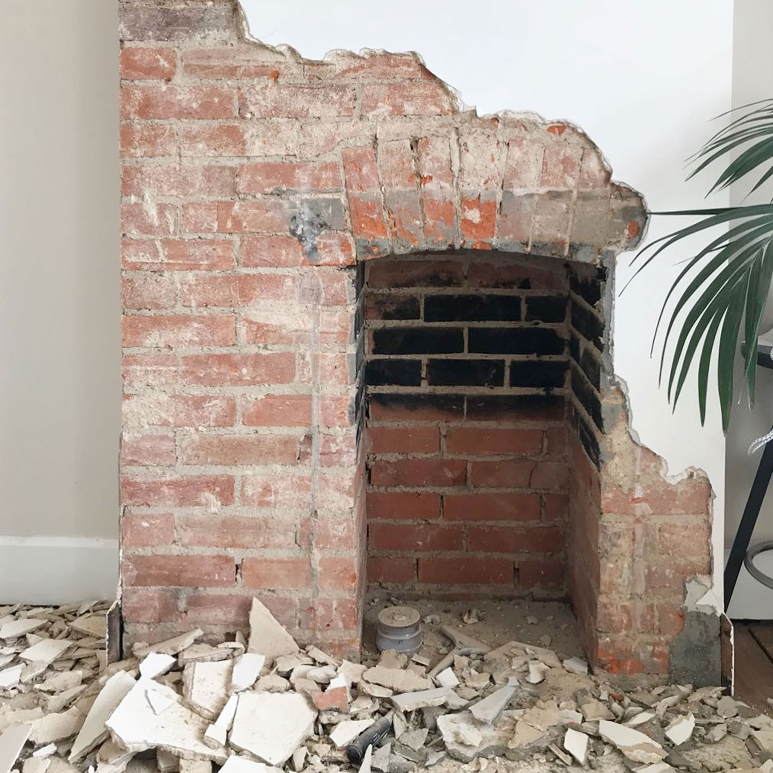 removing plaster from a brick fireplace