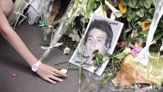 a picture showing benoit dupont de ligonnes, one of the five dupont de ligonnes family members murdered, has been set in front of their house, where they were discovered on april 21, on april 26, 2011 in the french western city of nantes, during a march in memory to the victims french authorities issued an international search alert on april 23 for murder suspect xavier dupont de ligonnes amid evidence that he carefully planned the killing of his wife and four children afp photo jean sebastien evrard photo credit should read jean sebastien evrardafp via getty images
