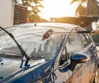 A brush washing a car