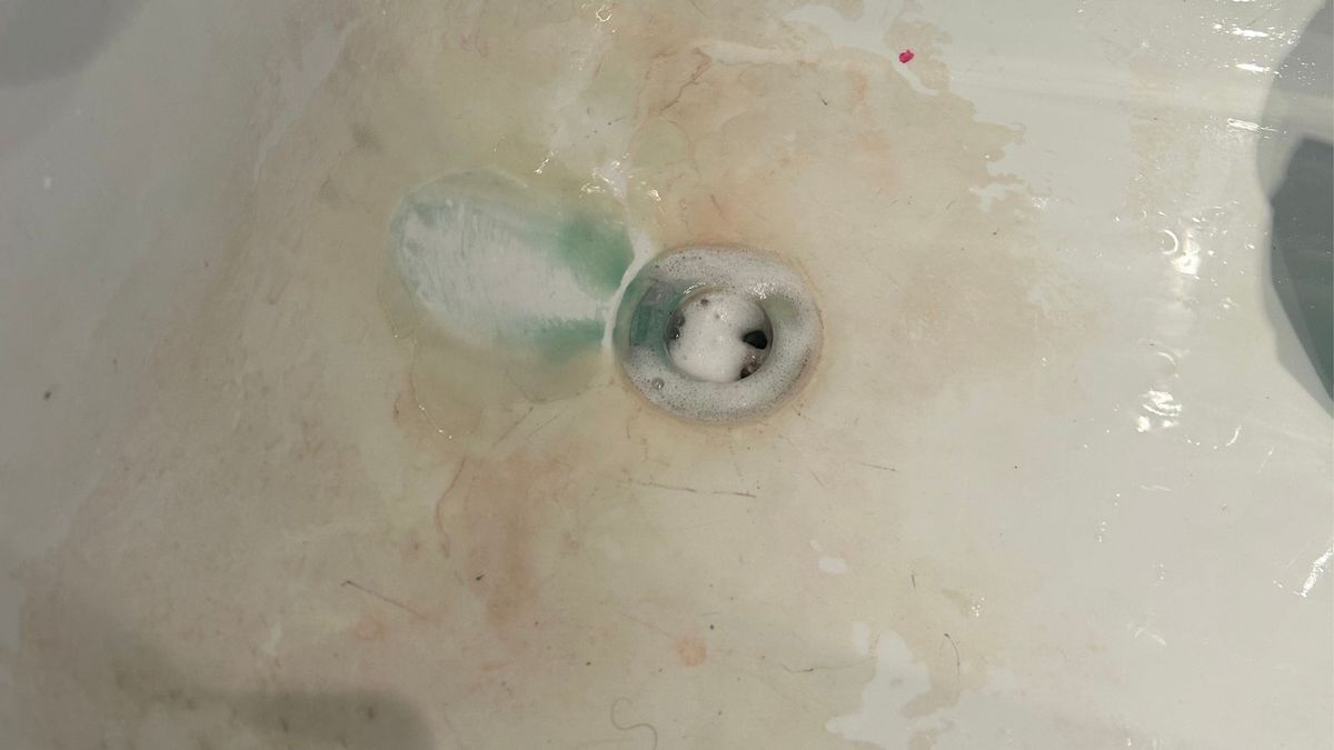 Bathtub hole covered with limescale