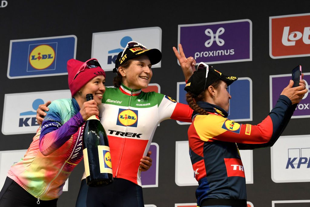 From left: Second place Canyon-SRAM Polish roder Katarzyna Niewiadoma, winner Lidl-Trek's Italian rider Elisa Longo Borghini, and third place Lidl-Trek's Dutch rider Shirin Van Anrooij celebrate on the podium following the women's race of the 'Ronde van Vlaanderen' (Tour des Flandres) one day cycling race, 163 km from Oudenaarde to Oudenaarde, on March 31, 2024. (Photo by LAURIE DIEFFEMBACQ / Belga / AFP) / Belgium OUT