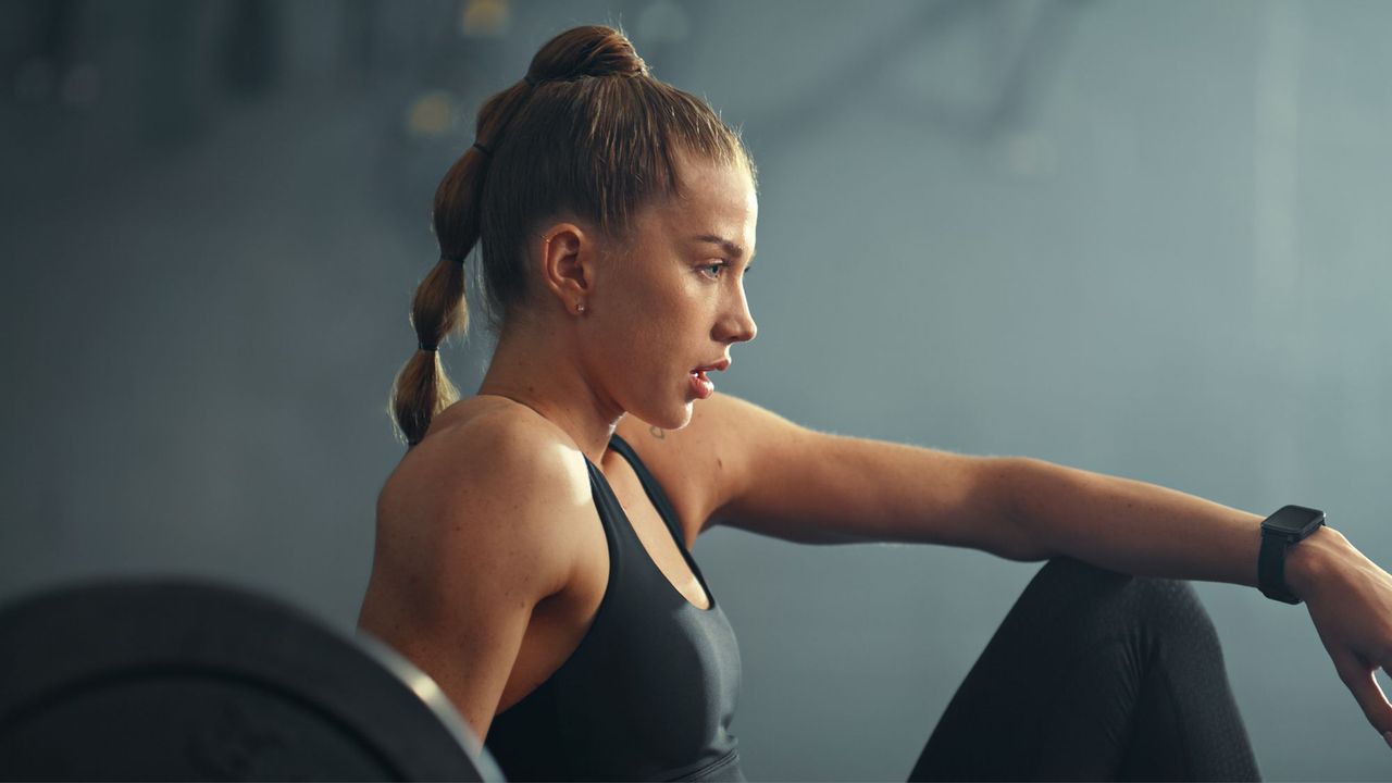 A woman doing low intensity strength training at the gym