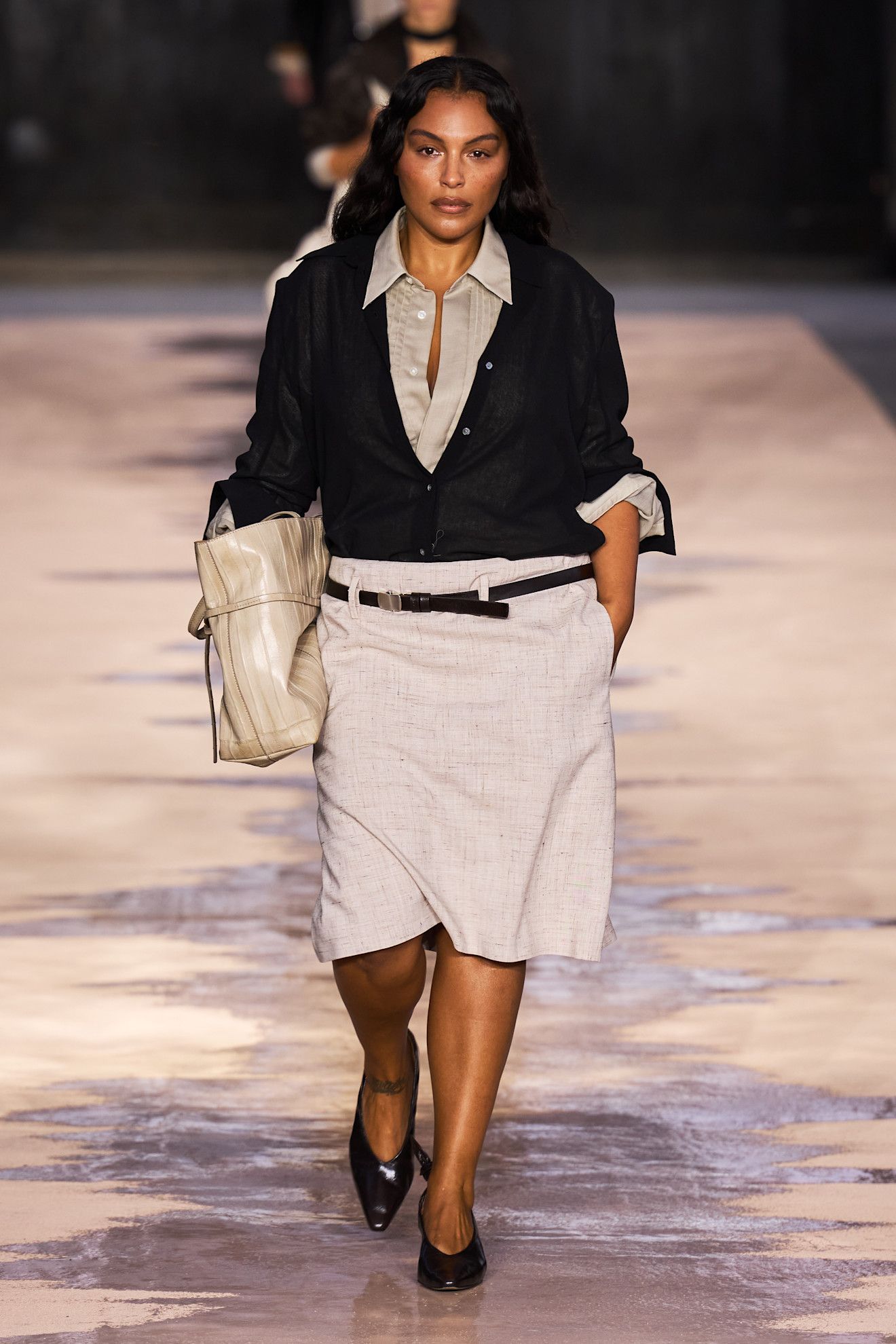 An image of poet cote, one of the biggest fashion trends for 2026, on the Boss spring/summer 2026 runway.