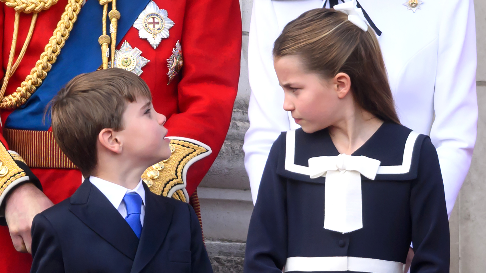 Princess Charlotte giving Prince Louis a stern look at Trooping the Colour