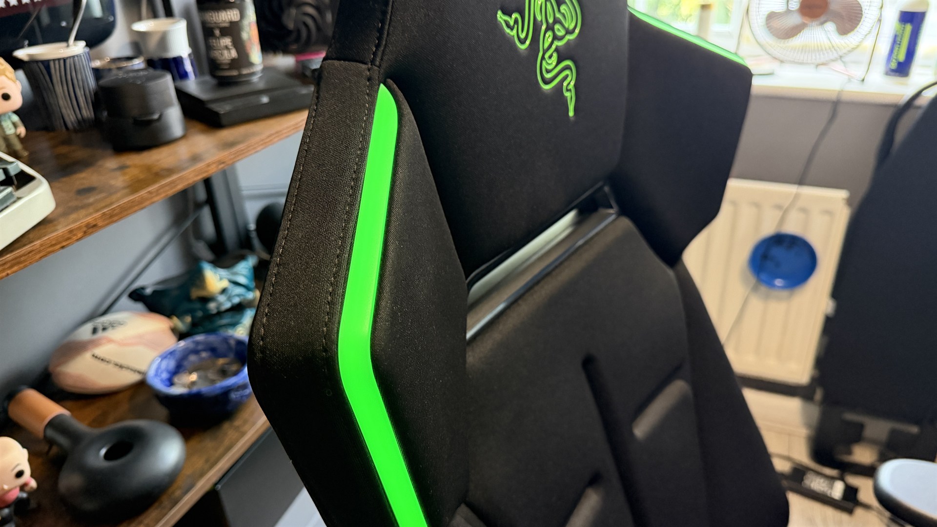 The Razer Soma Chroma gaming chair set up in front of a desk.