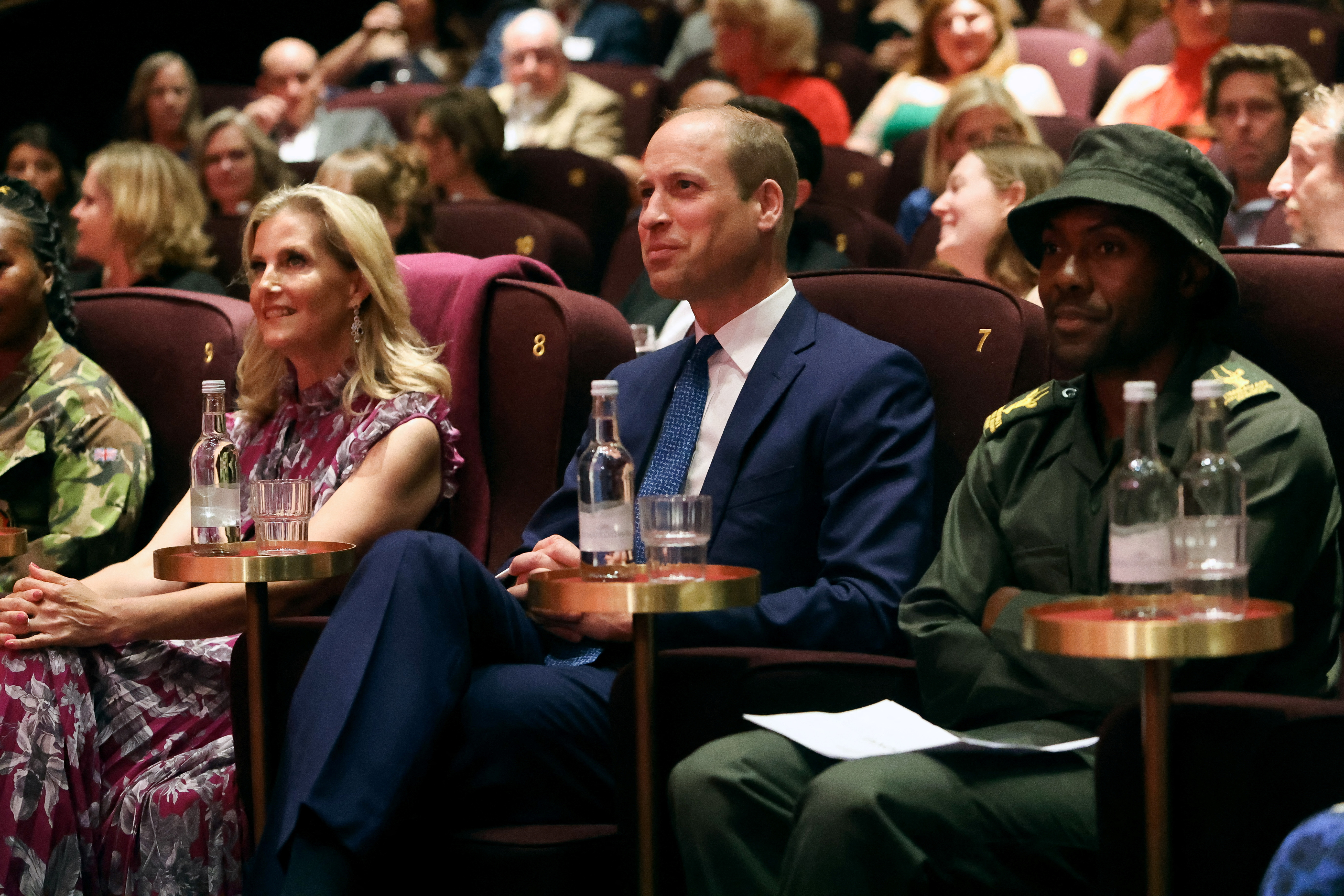 Prince William and Duchess Sophie sitting next to each other in chairs at a movie