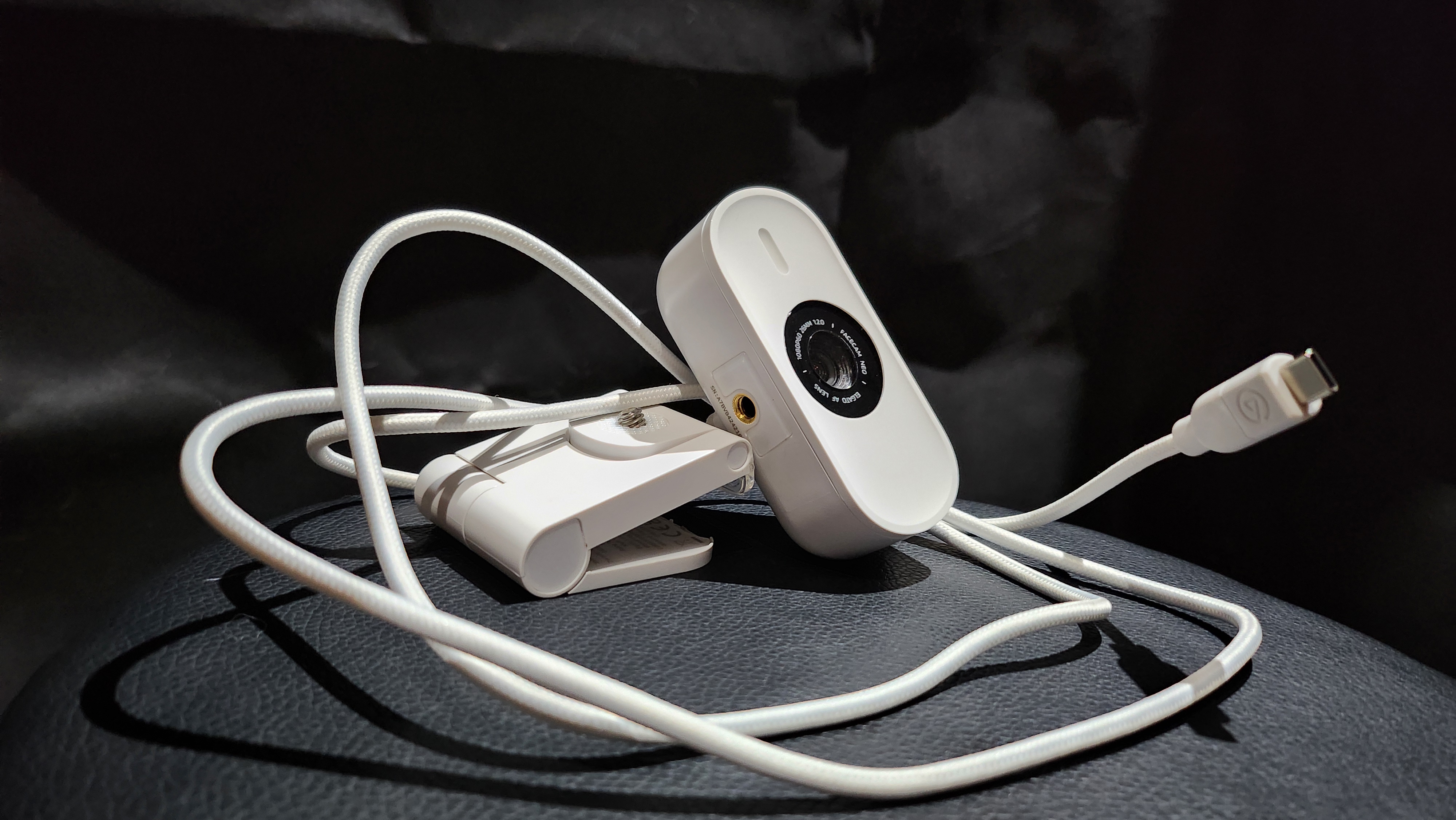 Elgato Facecam Neo placed on a desk.