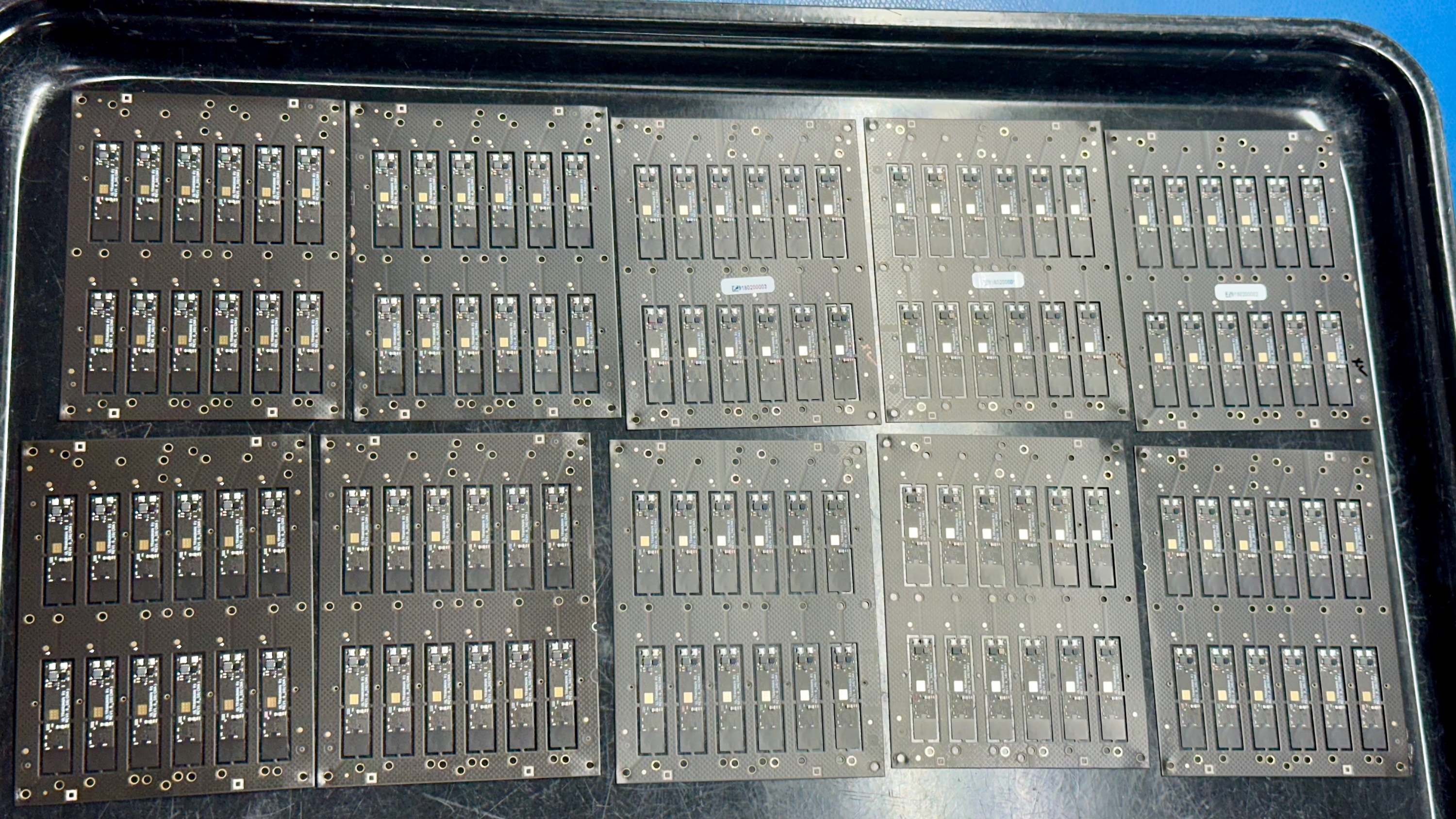 A series of PCB component sheets, with 12 PCBs per sheet to make 12 Ultrahuman Ring Airs.