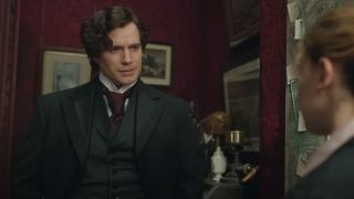 Henry Cavill looking exasperated in his study in Enola Holmes 2.